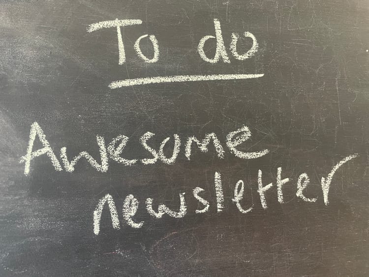 Chalk writing saying "to do awesome newsletter"